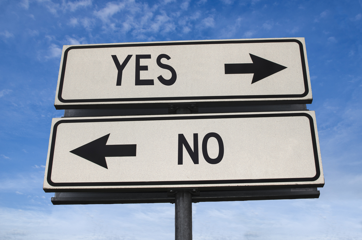 Yes vs no. White two street signs with arrow on metal pole with word. Directional road. Crossroads Road Sign, Two Arrow. Blue sky background. Two way road sign with text